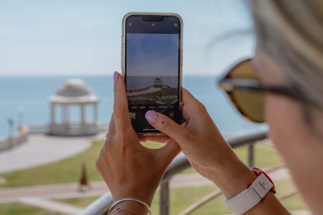Taking a photo of the seafront from de la warr pavilion