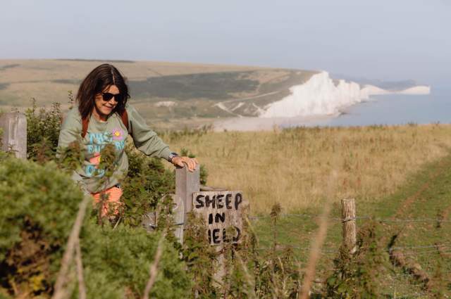 A lone walker on the South Downs Way with Seven Sisters in the background