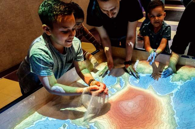 Boy playing with Sand Table at Science Central &copy;Luke Menard for Visit Fort Wayne