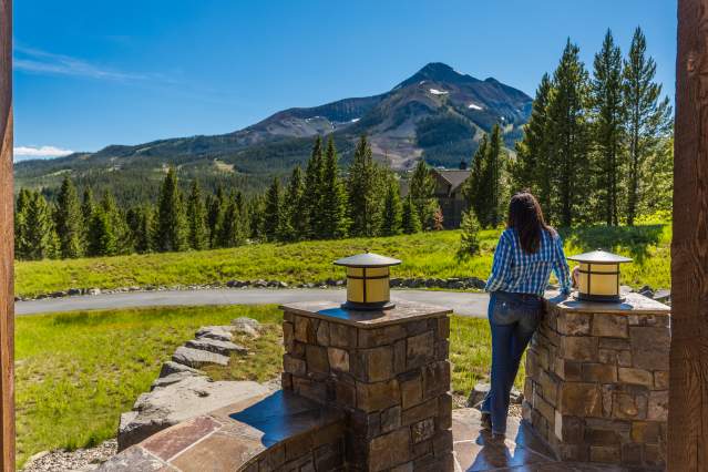 Woman looking at Lone Peak