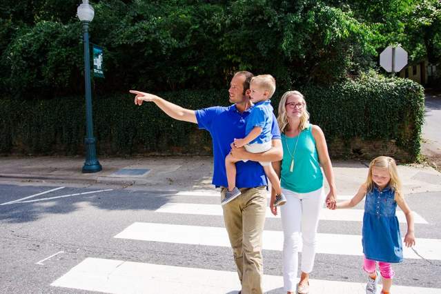 family crossing the street