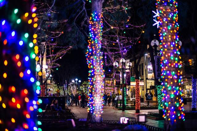 Boulder's Pearl Street lit up with Christmas lights in winter.