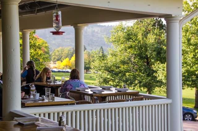 Guests enjoy a meal on the veranda at Chautauqua Dining Hall in Boulder