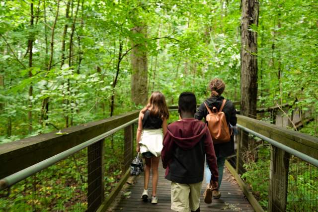 Family on trail through the Lindenwood Nature Preserve
