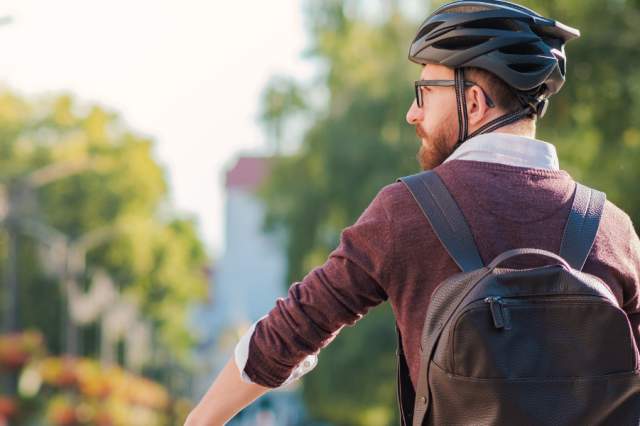 Biker with backpack in town