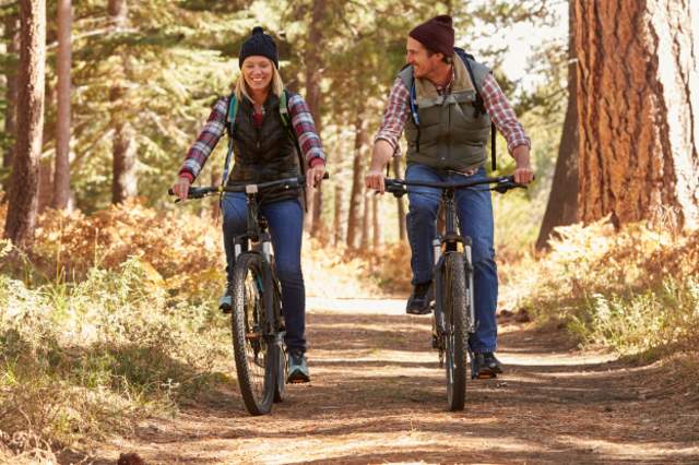 Man and Woman Mountain Biking