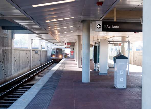 Silver Line train arriving at the Ashburn Metro station platform, the western end of Metro's Silver Line