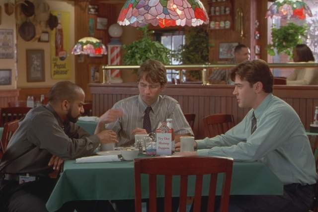 Office Space screengrab showing three men sitting around a table inside Chotchkies restaurant