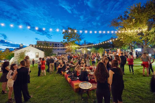 twilight at fair market outdoor event venue with people and twinkle lights in austin texas