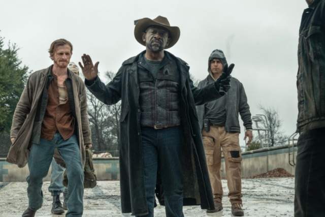 Fear the Walking Dead screengrab showing four men talking at an apocalyptic skate park