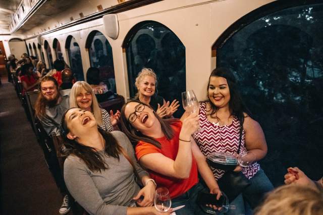 friends laughing on the jazz wine train