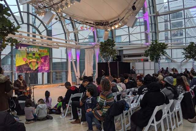 Art and Soul Kickoff: Large crowd in Indy Artsgarden watching performers