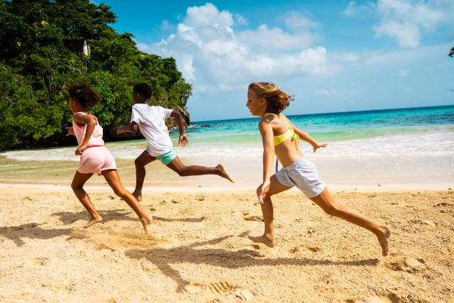 Children running on beach - Frenchman's Cove