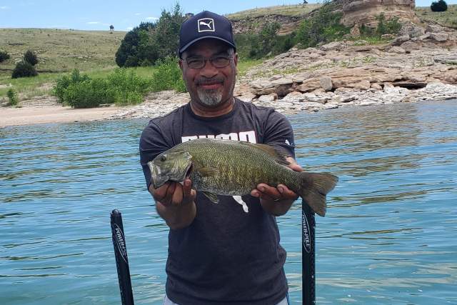 Man Holding Bass