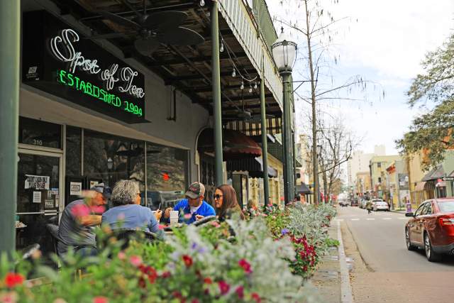 outdoor seating on the sidewalk of Dauphin Street, downtown Mobile