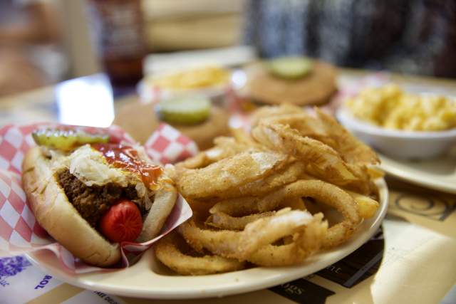 Hot dog with sour kraut and onion rings