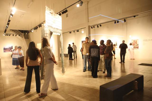 People enjoy artwork on display at a museum