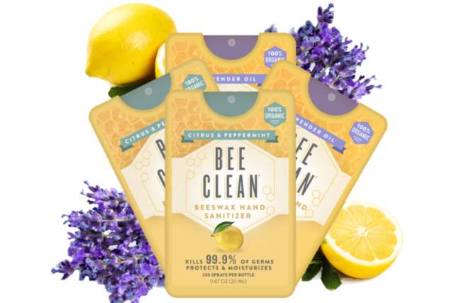 Four-pack of Bee Clean citrus hand sanitizer, claiming to kill 99.9% of germs and made with organic ingredients including lavender oil and lemon. The image displays lemons, a lavender branch, and an American flag icon indicating it's made in the USA. Each bottle contains 200 sprays.