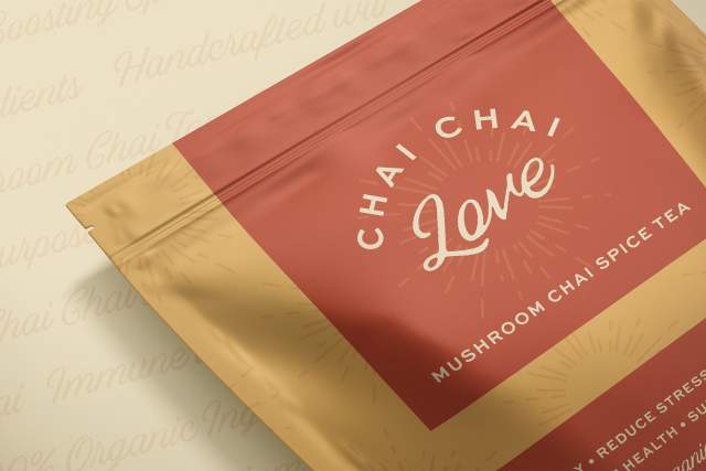 Package of "Chai Chai Love" mushroom chai spice tea, presented on a decorative background with chai-related words.