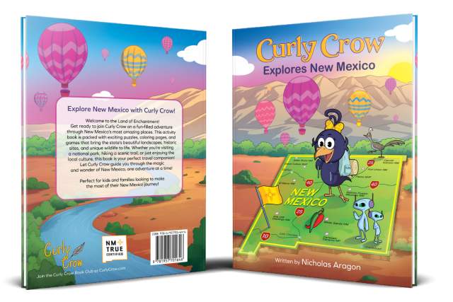 Book cover of "Curly Crow Explores New Mexico" depicting a cartoon crow on a scenic New Mexico landscape with hot air balloons and a river, authored by Nicholas Aragon.