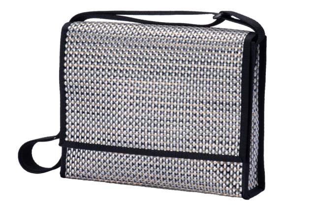 A close-up view of a compact, silver mesh travel organizer with a black zipper and handle, isolated on a white background.