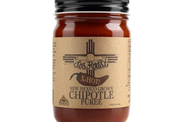 A jar of Los Roast X-Hot New Mexico Grown Chipotle Puree on a white background.