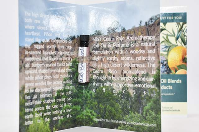 Brochure for Mia's Botanicals Roll-On, opened and displaying text and images detailing the product's benefits and natural ingredients.
