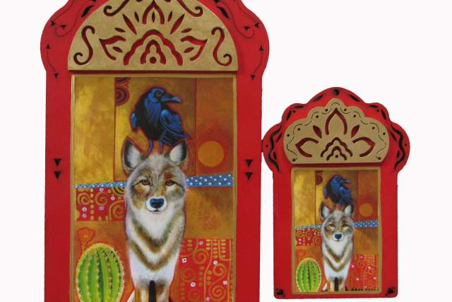 Two vibrant paintings of foxes set in ornate red frames. The larger frame on the left features a full-bodied fox in a colorful desert setting, and the smaller one on the right shows the head of a fox against a similar backdrop. Both frames have intricate patterns and decorative motifs.