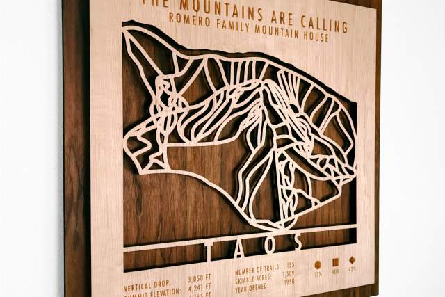 Custom wooden wall art featuring a map of Taos Mountain ski trails with details such as summit elevation and number of trails.