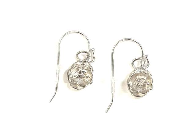 Sterling silver buttercup shaped earrings on a white background.