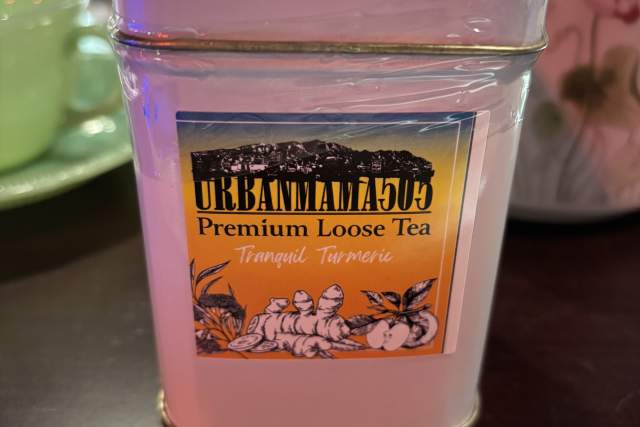 A rectangular tin of Urbanmama505 Premium Loose Tea with a colorful label.