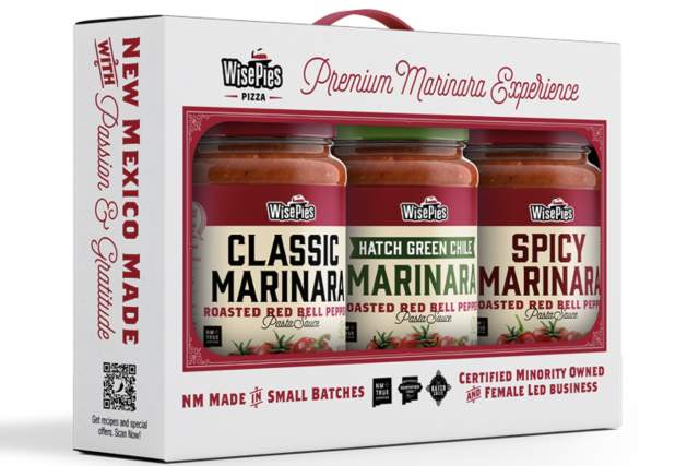 Product packaging for WisePies Pizza's "Premium Marinara Experience," featuring three jars of marinara sauce labeled Classic, Hatch Green Chile, and Spicy. The packaging emphasizes New Mexico origin, small batch production, and certifications as minority-owned and female-led business.