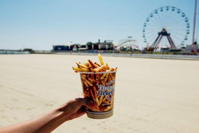thrashers in front of ferris wheel