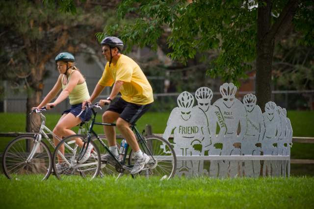 People Riding Bikes Through Omaha Park