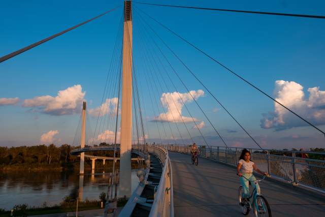 Person Riding Bike Across Bob the Bridge in Omaha