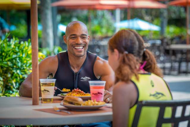 A couple eating at Discovery Cove Laguna Grill