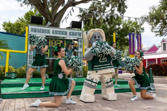 Lego figure cheerleader with group of cheerleaders.