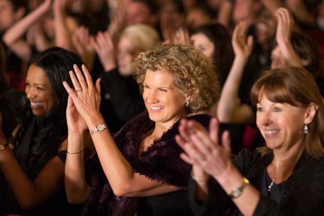 An audience claps at the Dr. Phillips Center for the Performing Arts in Orlando.