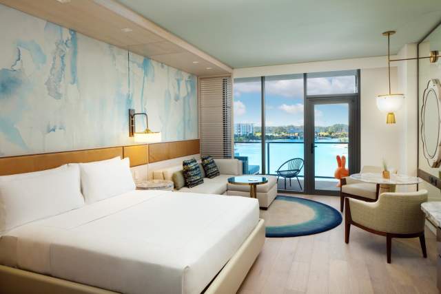 King guestroom with lagoon view and balcony at Conrad Orlando