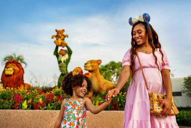 A woman and young girl walk in front of topiaries at the EPCOT International Flower & Garden Festival, held annually at Walt Disney World Resort in Orlando.