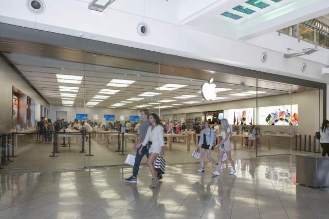People walking by Apple Store at the Mall at Millenia