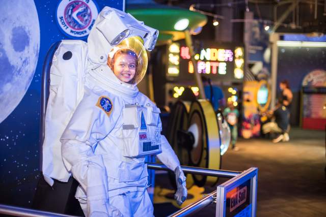 WonderWorks girl in astronaut suit
