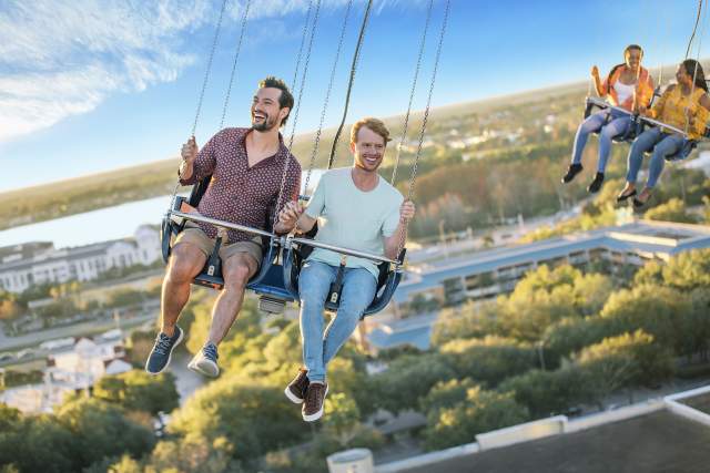 A gay couple riding the Orlando Starflyer at ICON Park