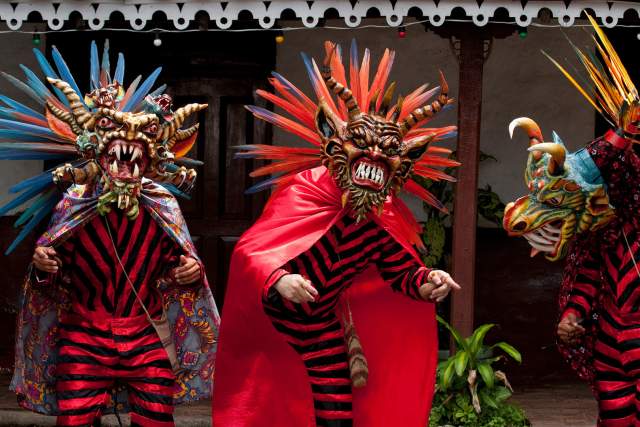 People dressed with diablicos traditional costume and Devil mask