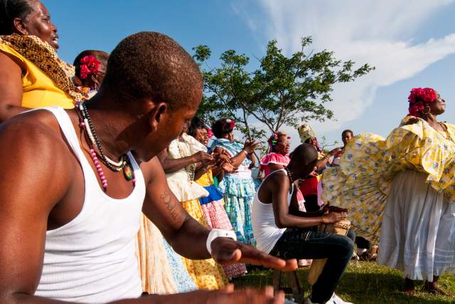Men playing drums and women performing congo dances  spanish colonial fortress.  Colon province, Panama, Central America.