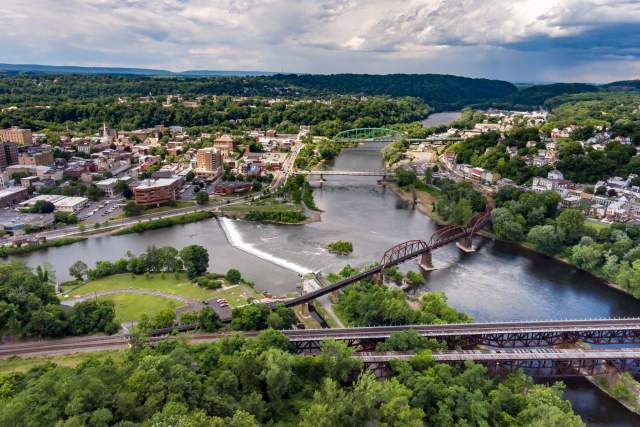 An aerial view of a town with a river flowing through various areas of the land