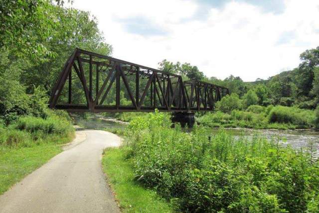 A metal bridge over a creek