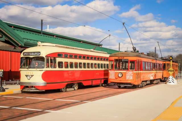 Two trolley cars on tracks