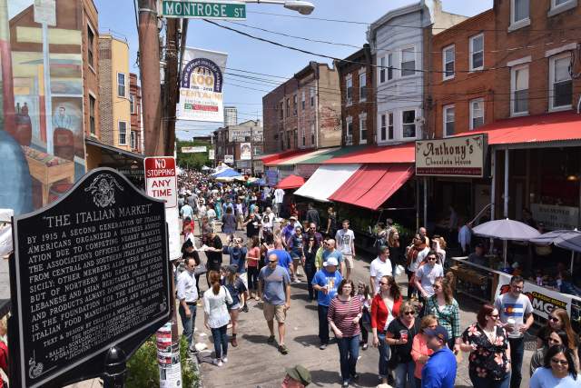 A crowd of people at a street festival