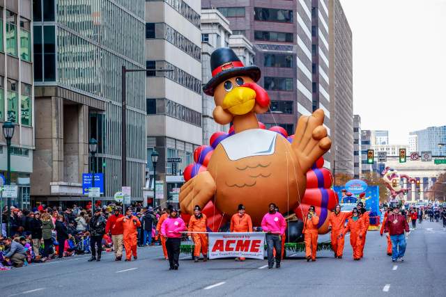 Giant inflatable turkey being pulled by people at Philadelphia's Thanksgiving Day parade